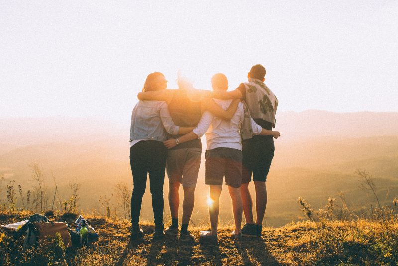 Group of students with sunset